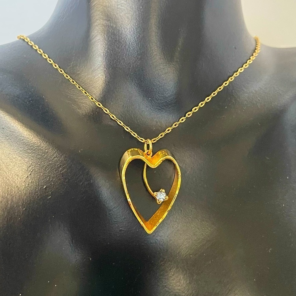 Gold tone heart blue stone necklace